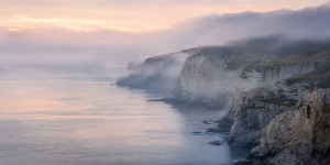 Premium misty coastal cliffs nature cover for Chatway vs Tawk.to: Free Live Chat or All-in-One AI Engagement?